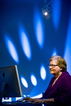 A learner sitting and working on a Mac computer