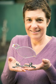 Lady displaying final glasswork piece