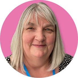 a woman with silver shoulder length hair