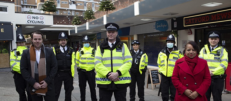 A group of uniformed police officers with Councillor Brenda Dacres and Councillor James-J Walsh